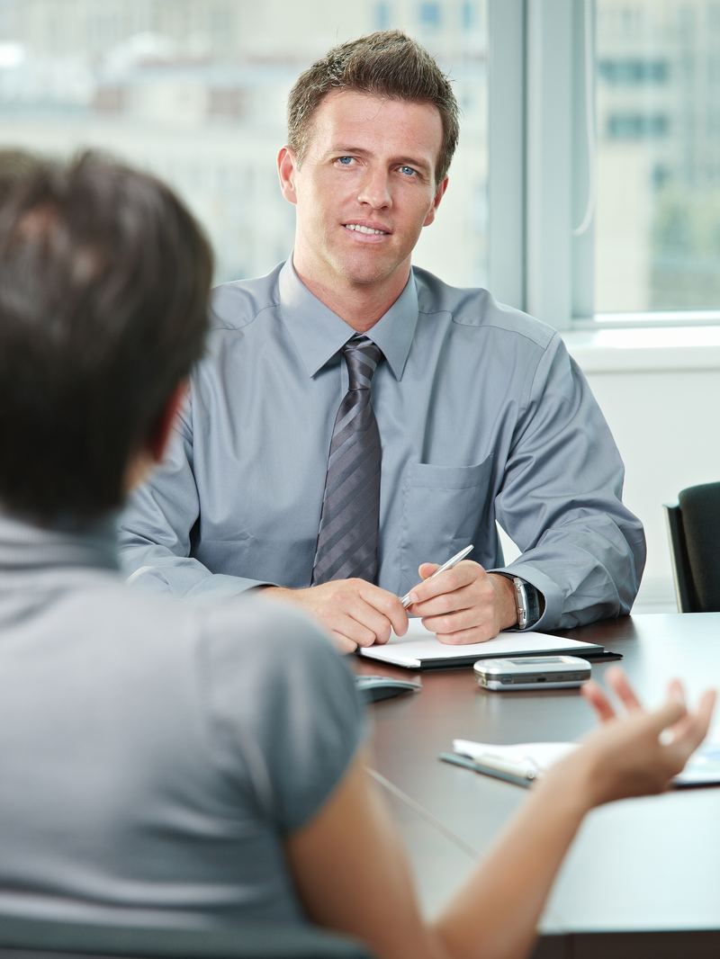 Professional in a one-on-one interview conversation